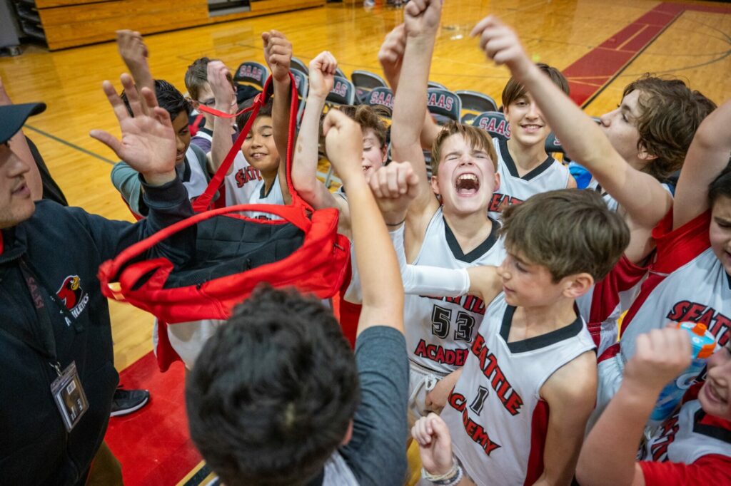 Students celebrate a basketball game
