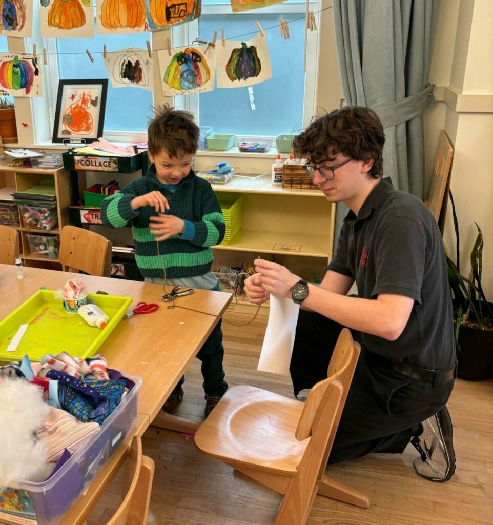 student and teacher at desk