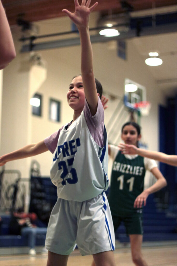 students playing basketball