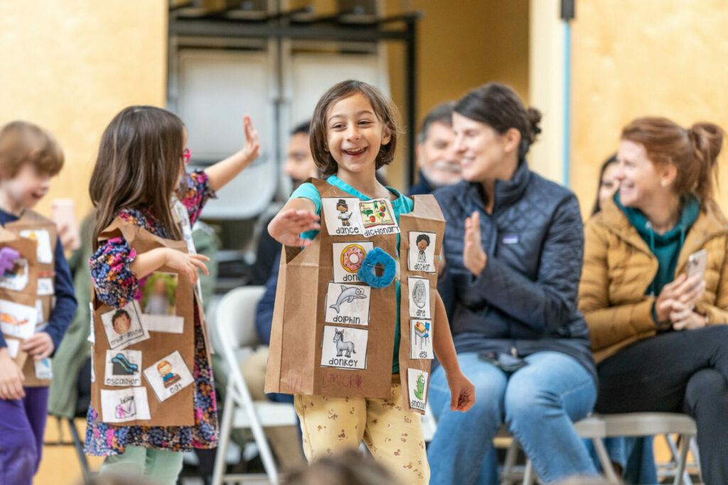 Kindergartners from The Meridian School put on a fun performance in front of the school to present their learning in literacy.