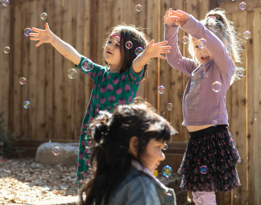 students playing with bubbles