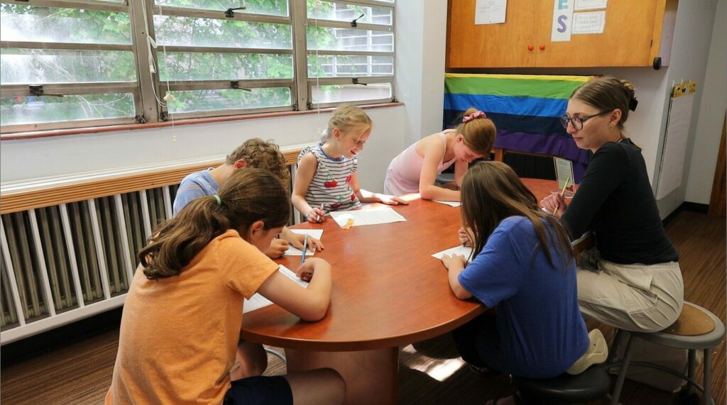 small group of students reading together with a teacher