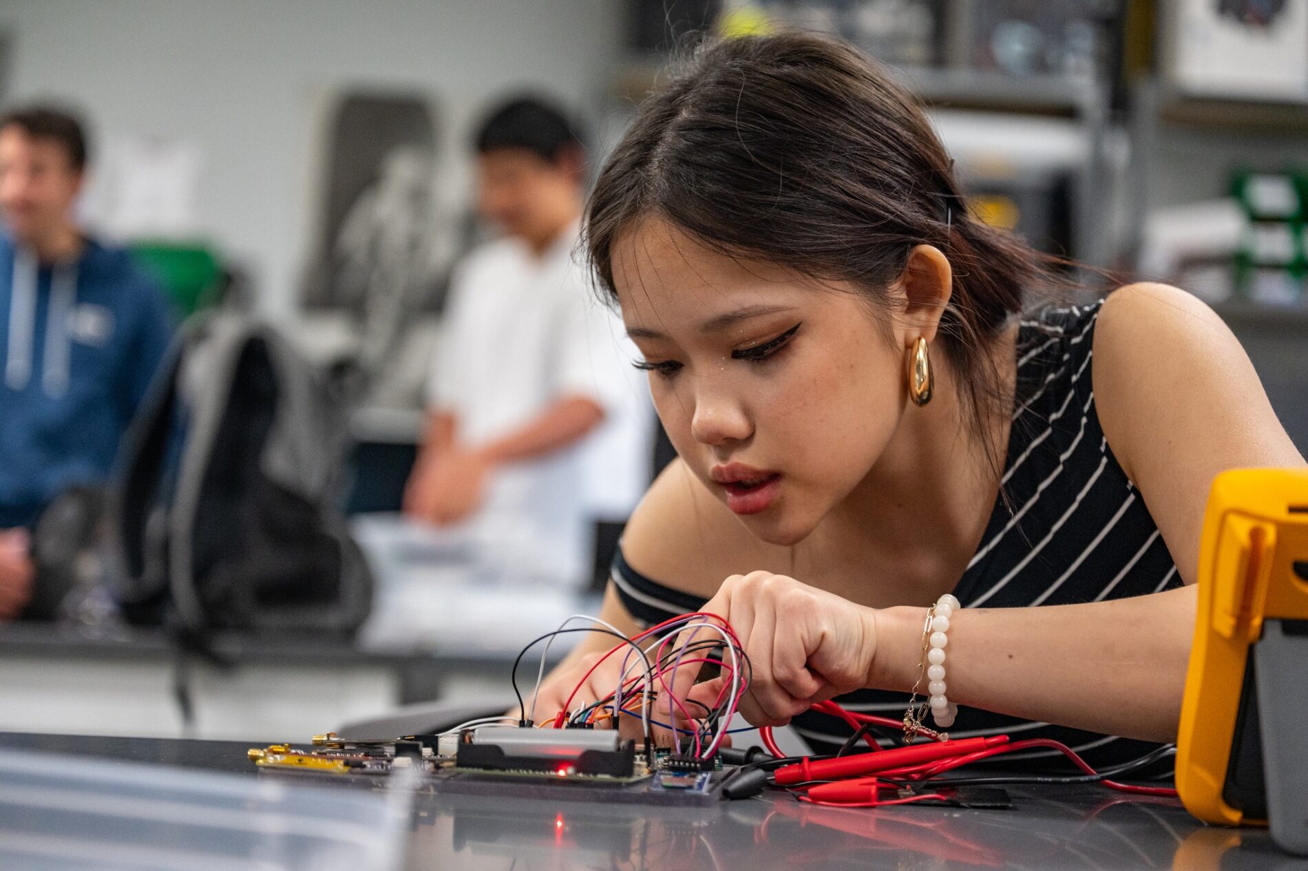 alum working on robotics