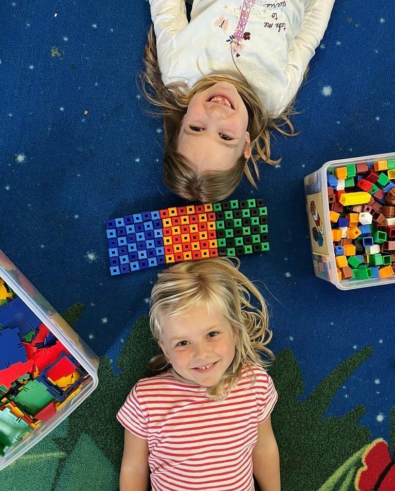 students laying on ground
