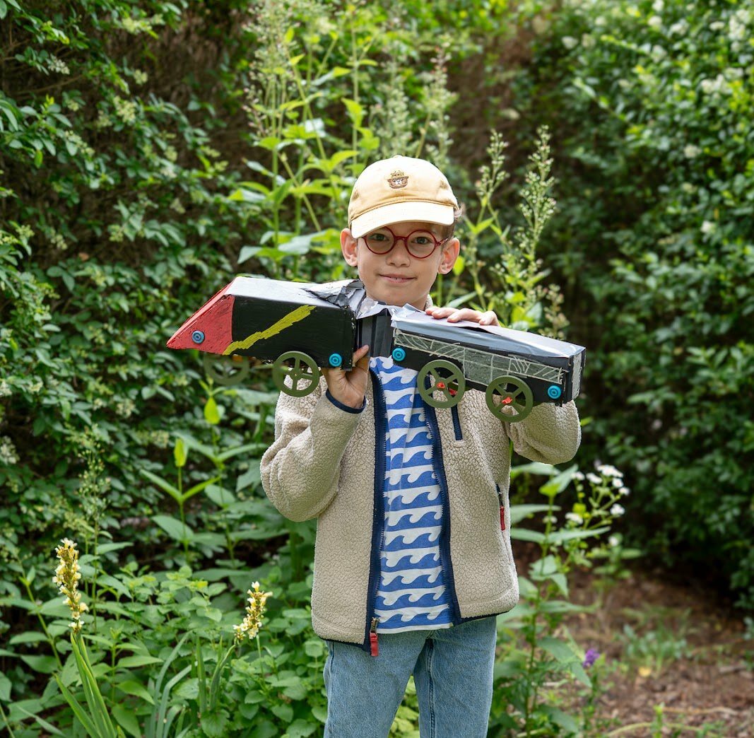 Student posing with creativity lab project.