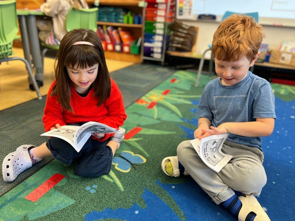 students reading on gorund