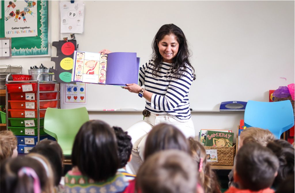 student reading to class