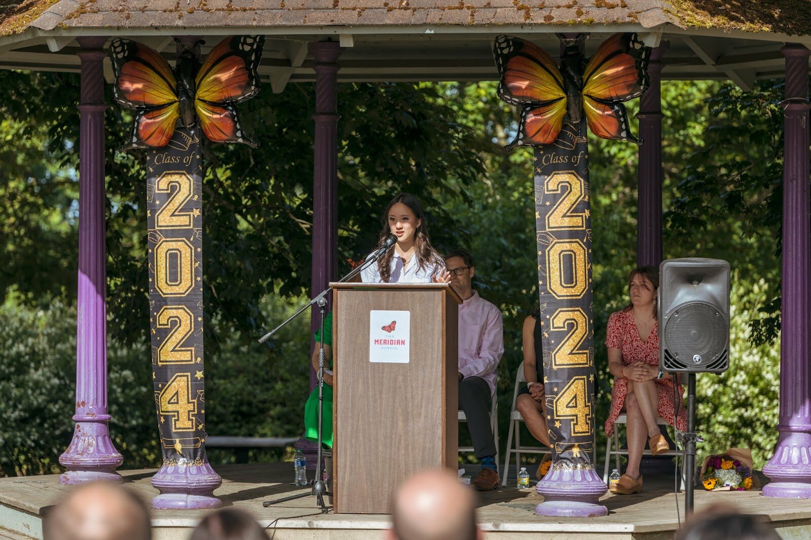 student speaking in front of group