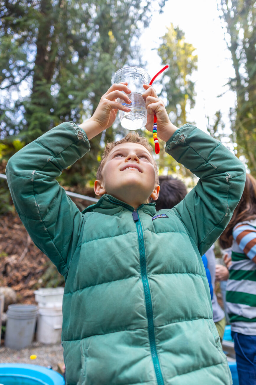 Students release salmon into Carkeek River