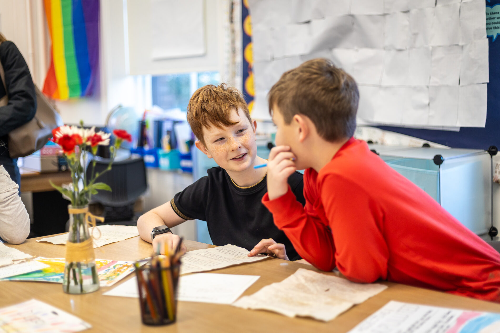 Meridian Monarchs work on a school project together in class.