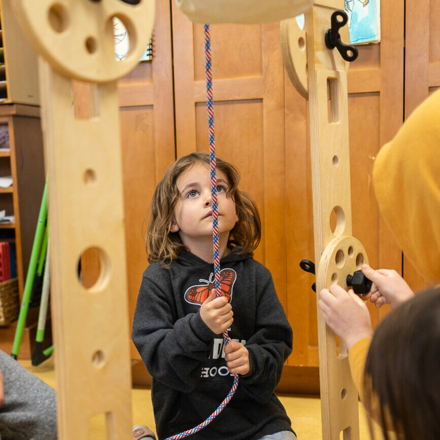 A kindergarten student at The Meridian School learns about engineering through math and science games.