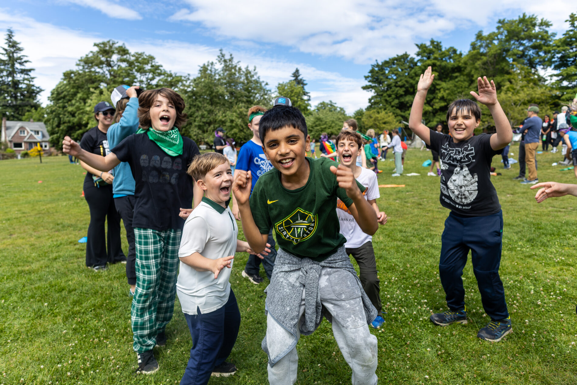 Students celebrate after a game of kickball in The Meridian School