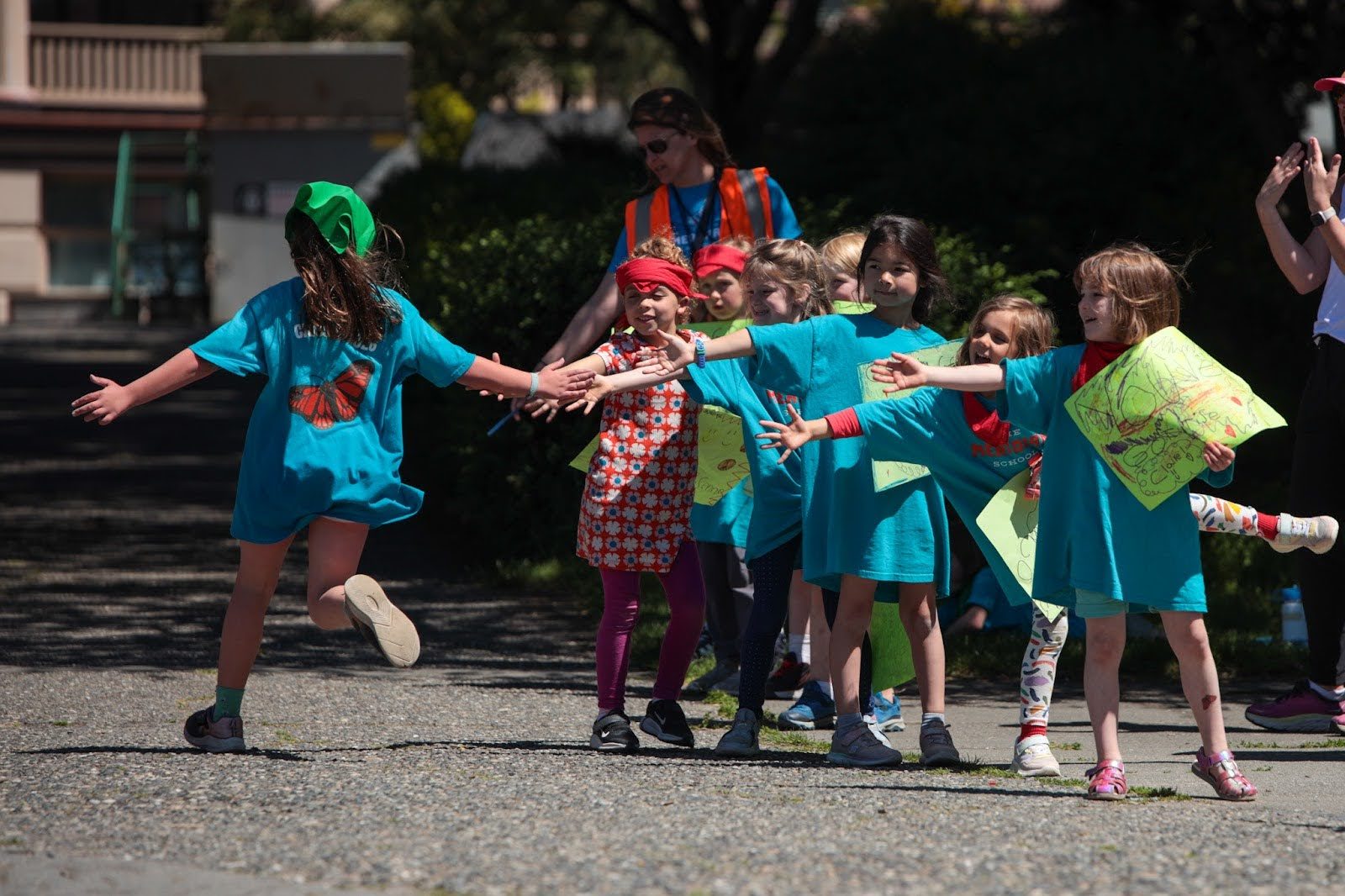 students high fiving in line