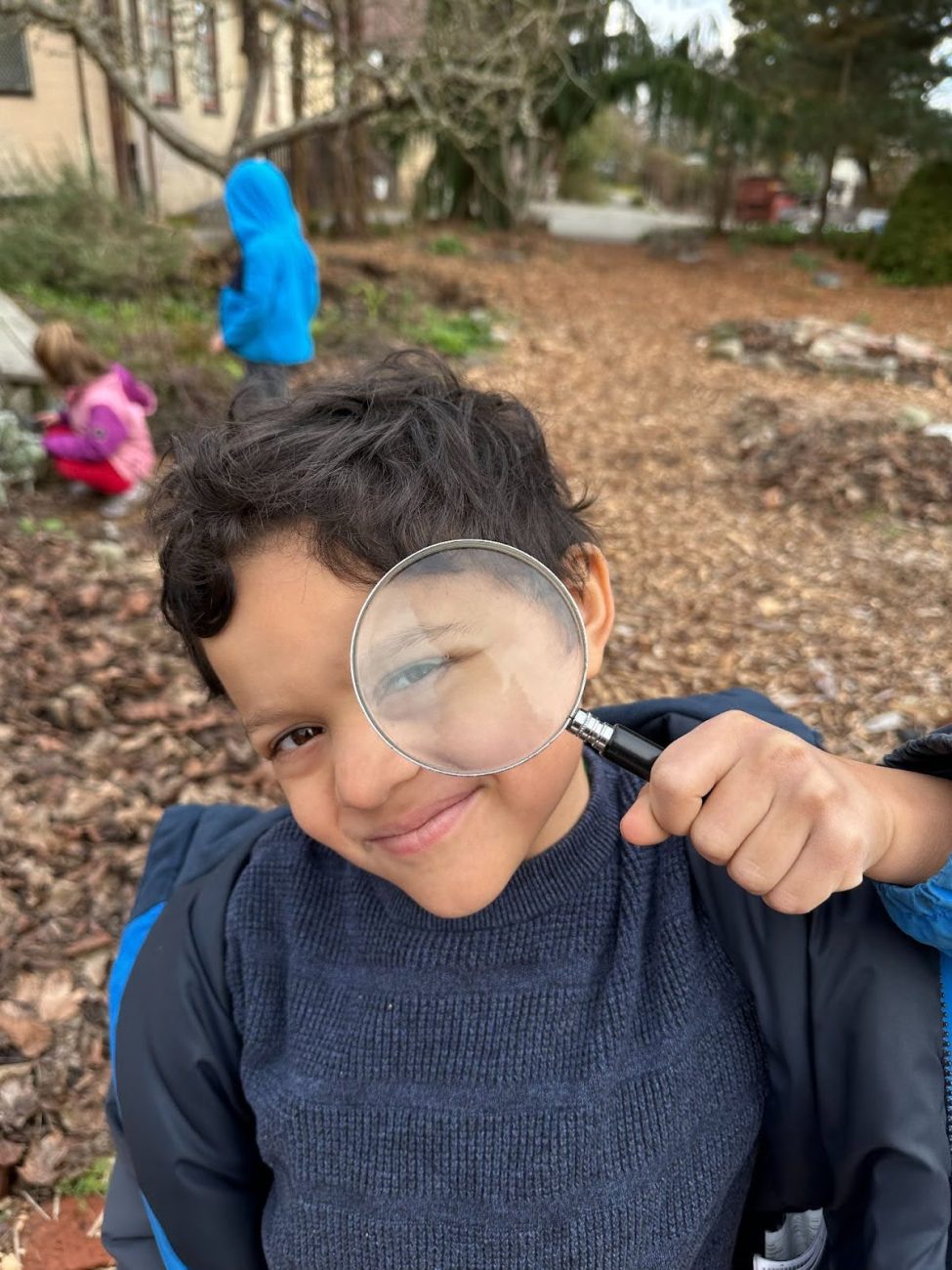 student with magnify class